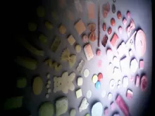 photo of different foods like a single noodle, a single chip, presented on a table and sorted by color